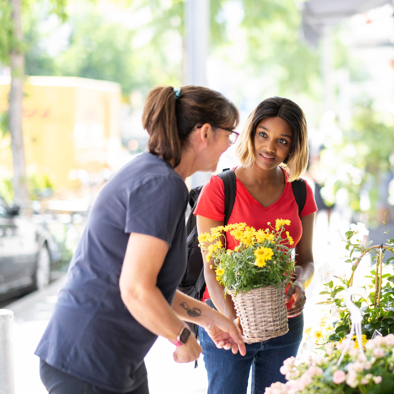 Woman gets advice at Florist Store